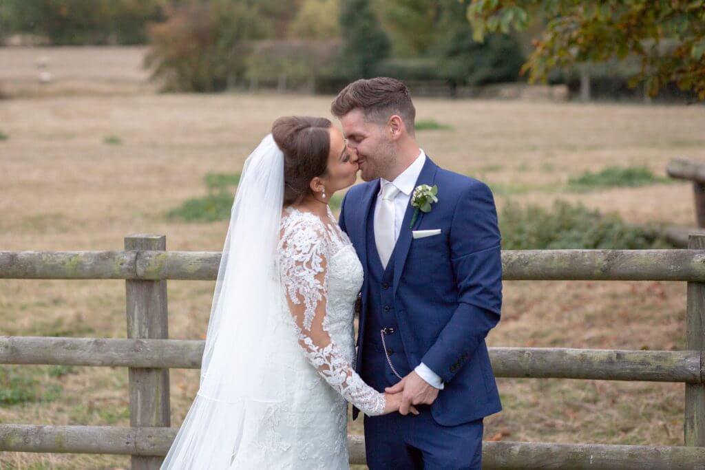 16 bride groom kiss mythe barn luxury venue leicestershire oxfordshire wedding photography