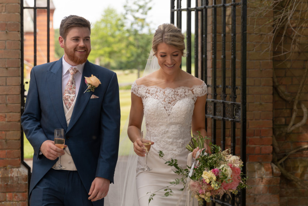 26 bride groom drink champagne the elvetham hartley wintney hampshire oxford wedding photographer