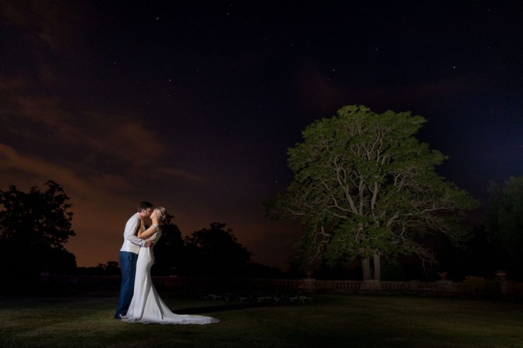 bride groom kiss under stunning twilight sky elvetham hampshire s r urwin wedding photography 1
