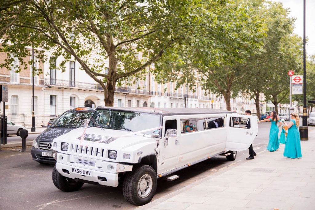 22 bridal party enter stretch hummer bridal car marylebone hotel london oxfordshire wedding photographer