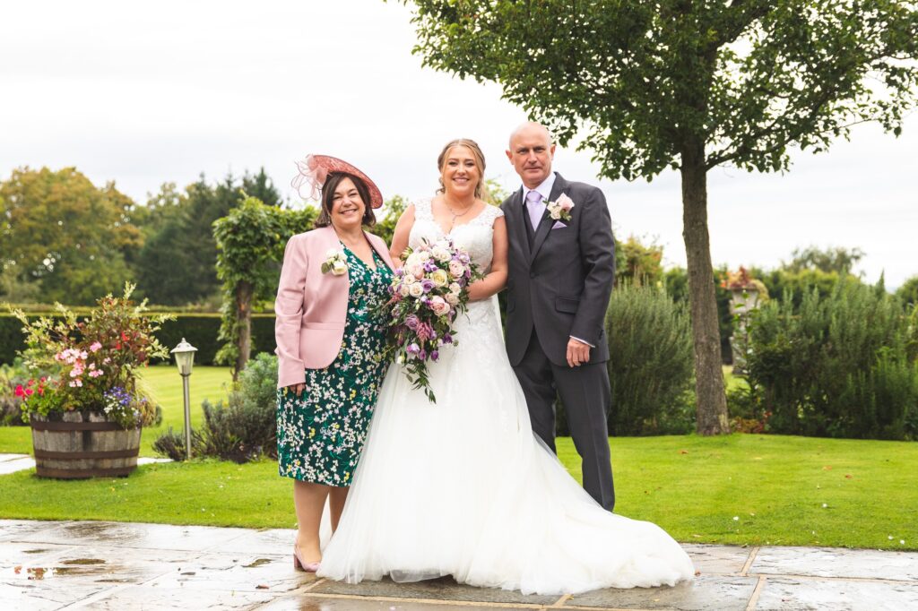 bride mother of the bride father of the bride formal portrait cain manor gardens surrey oxfordshire wedding photographer