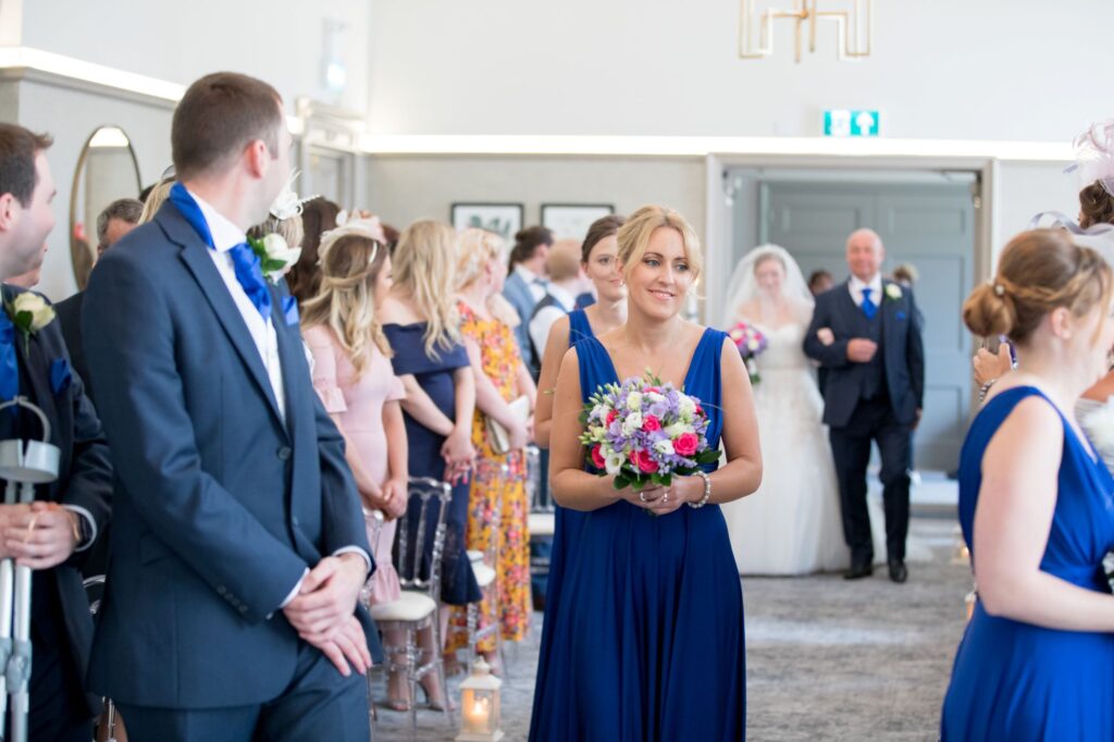 bride enters marriage ceremony de vere beaumont hotel windsor oxfordshire wedding photographers
