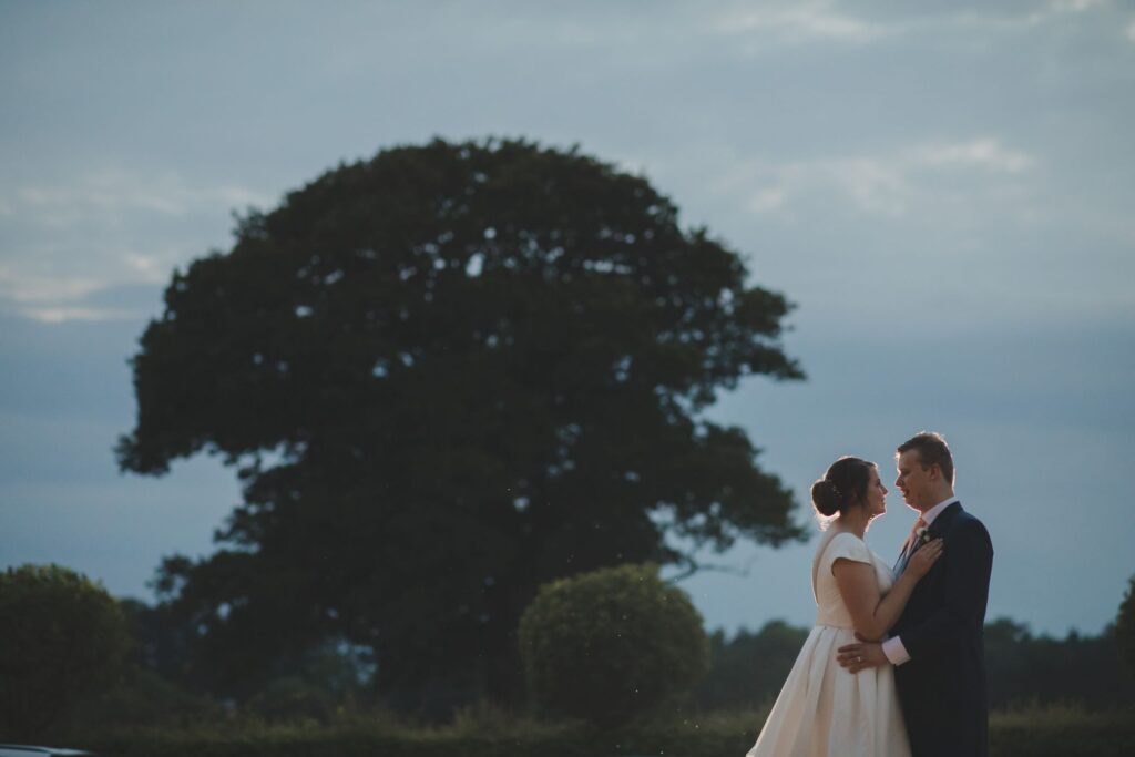 121 bride grooms evening embrace thorganby venue grounds north yorkshire oxford wedding photographers