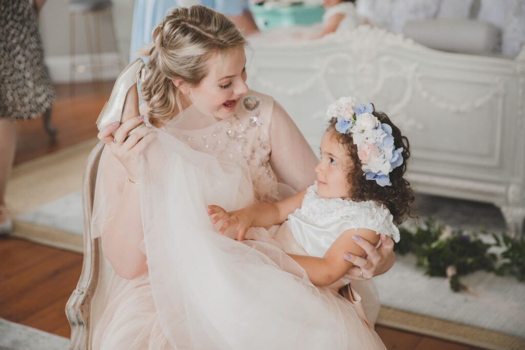 32 bridesmaid admires flowergirls shoes bridal prep thicket priory york oxford wedding photography